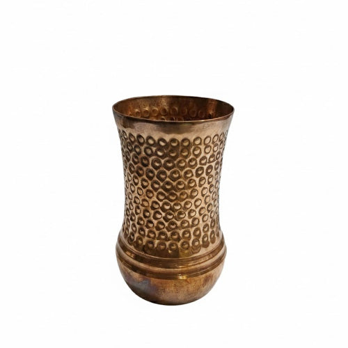 A beautiful, tall copper tumbler featuring an intricate hammered pattern